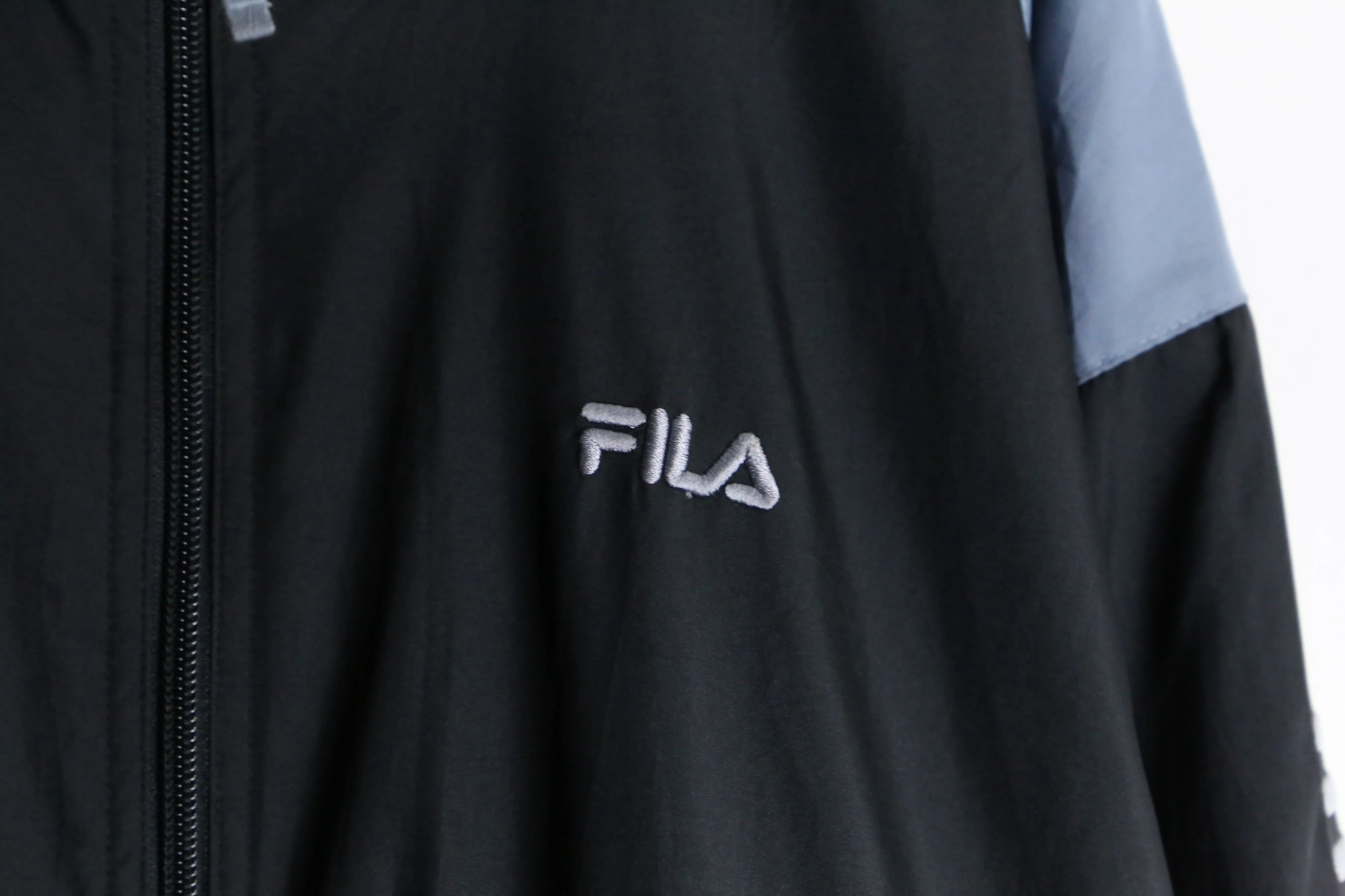 "FILA" dark tone high neck loose track jacket